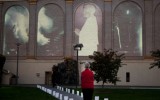 An onlooker stands before Ben Wood’s 9/11 memorial projection just before sundown.

